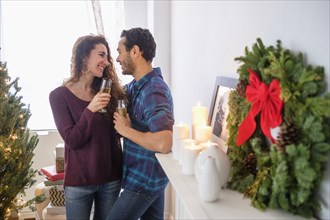 Couple drinking champagne at Christmas