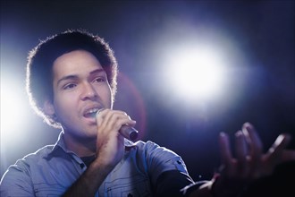 Mixed race singer performing on stage