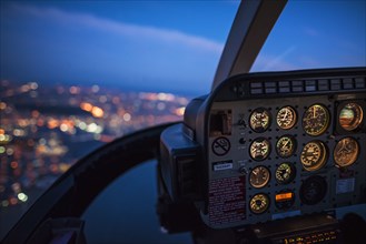 Close up of control panel of airplane flying at night