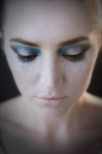 Caucasian woman wearing glamorous makeup