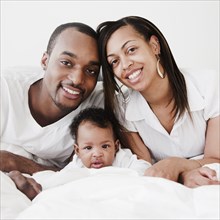 African couple and baby