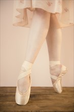 Caucasian ballet dancer standing en pointe