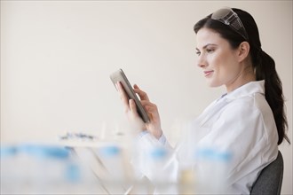 Caucasian scientist using digital tablet