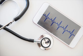 Stethoscope and pulse trace on cell phone