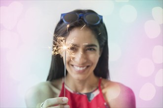 Indian woman holding sparkler