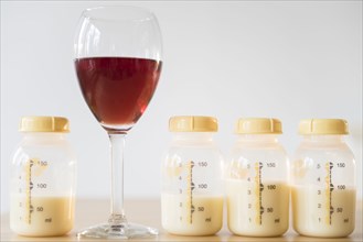 Red wine and bottles of breast milk