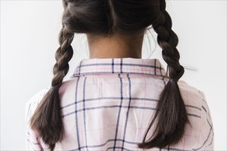 Pigtail braids of Mixed Race girl