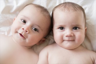 Portrait of Caucasian twin baby girls