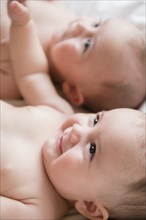 Smiling Caucasian twin baby girls