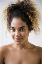 Portrait of Mixed Race woman with bare shoulders