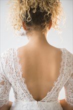 Back of Mixed Race woman wearing wedding dress