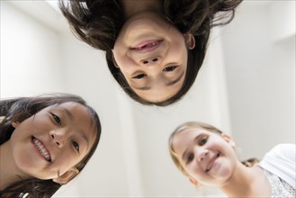 Portrait of smiling girls looking down