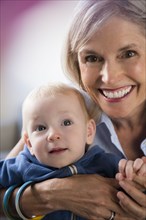 Portrait of smiling Caucasian grandmother and baby grandson