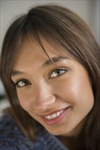 Portrait of smiling Mixed Race woman