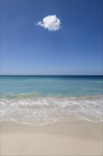 Cloud in blue sky over ocean beach