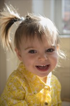 Portrait of smiling Caucasian baby girl