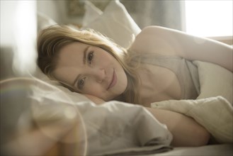Close up of woman laying in bed