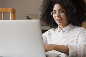 African American woman using laptop