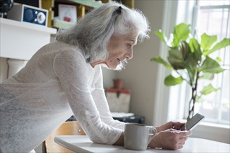 Older woman texting on cell phone