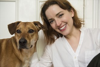 Portrait of smiling Caucasian woman and dog