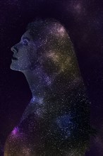Double exposure of Caucasian woman and stars in outer space