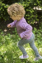 Caucasian girl running outdoors