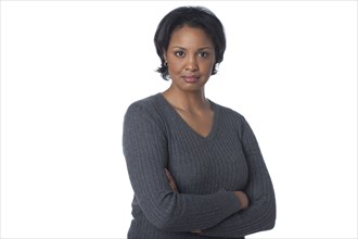 Serious mixed race woman with arms crossed
