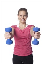 Caucasian woman lifting hand weights