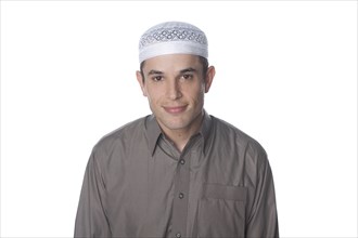 Mixed race man in Middle Eastern clothing