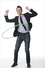 Caucasian businessman twirling plastic hoop