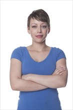 Smiling Hispanic woman with arms crossed