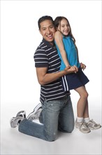 Hispanic father and daughter playing