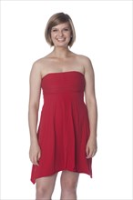 Smiling Caucasian woman in red dress