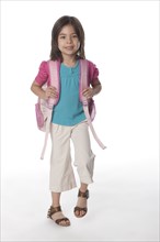 Mixed race girl carrying backpack