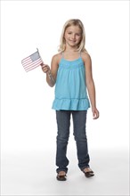 Caucasian girl holding American flag