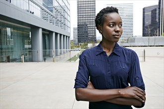 African American businesswoman standing on city street