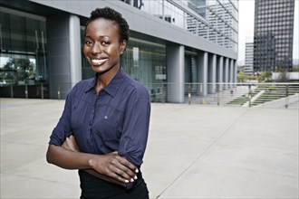 African American businesswoman smiling on city street