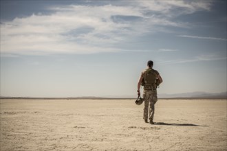 Soldier walking in remote desert