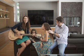 Family relaxing together in living room