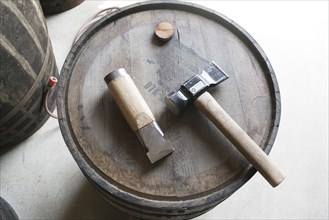 Hammer and chisel on whiskey cask