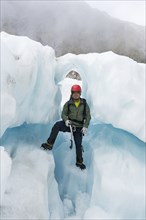 Portrait of Chinese man standing on glacier