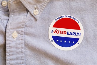 Close-up of voting sticker on shirt