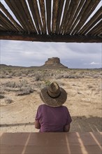 Rear view of woman in straw hat