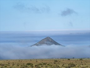 Clouds covering landscape in Cerrillos Hills State Park