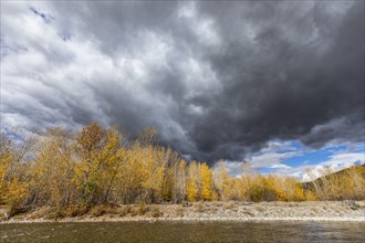 Storm clouds over Autumn forest and Big Wood River