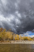 Storm clouds over Autumn forest and Big Wood River