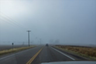 Blurred view of highway through windshield