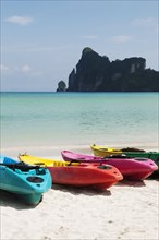 Colorful kayaks on beach