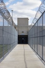 Pavement and chainlink fence in prison