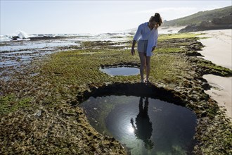 Girl exploring tidal pools